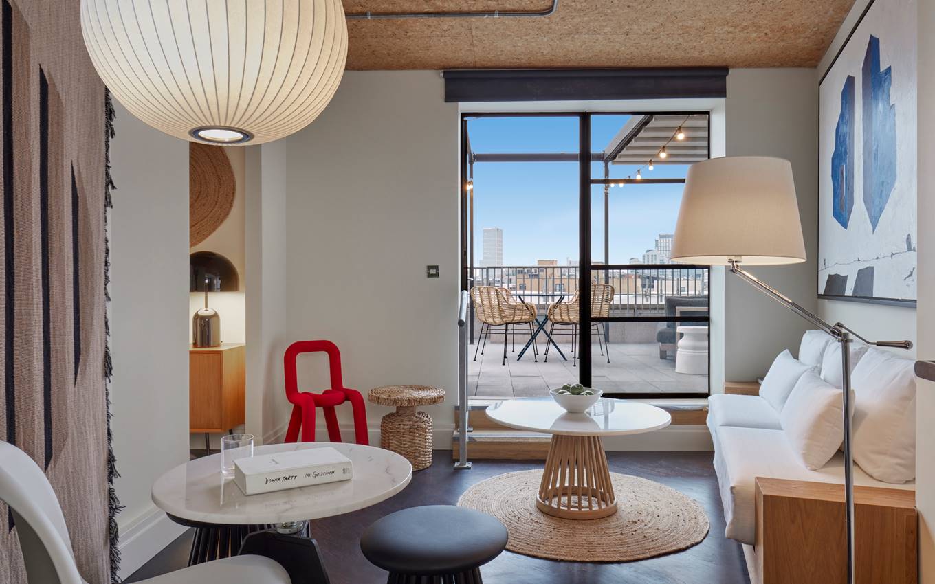 A cosy lounge area with plush seating and elegant decor, inviting guests to relax and enjoy the ambiance.