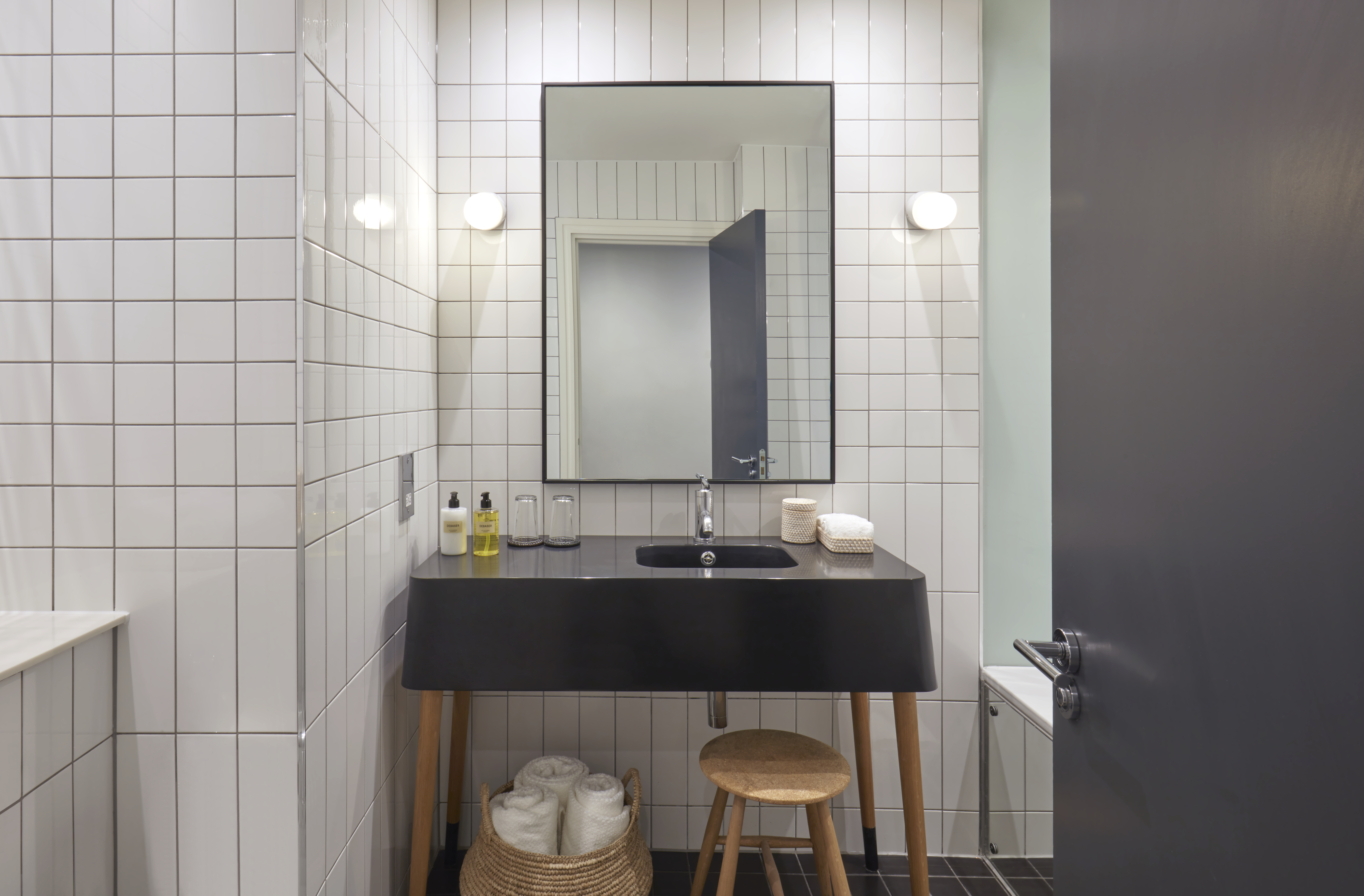 A stylish bathroom featuring a classic black and white tile floor, creating a timeless and elegant atmosphere.